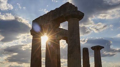 Archaic Temple of Apollo, Doric columns, The sun shines through ancient column ruins,