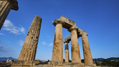 Archaic Temple of Apollo, Doric columns, Historical temple columns with a background of mountain