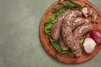 Raw kupaty, traditional Georgian sausages, raw sausages, with spices and herbs, Georgian cuisine