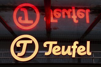 Teufel, facade with sign and logo, illuminated, reflection, Essen, Ruhr area, North