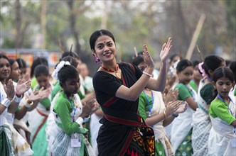 An instructor dance Bihu, as she teach participants during a Bihu dance workshop, ahead of Rongali