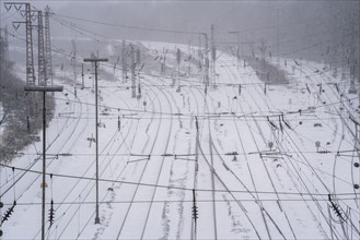 Onset of winter with lots of fresh snow and temperatures below -5 degrees during the day, railway