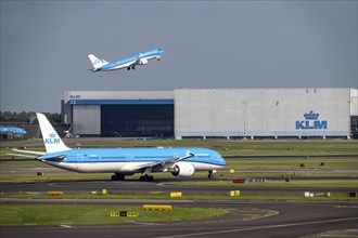 Amsterdam Schiphol Airport, aeroplanes on the taxiway, KLM aircraft taking off from the