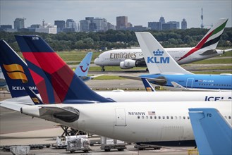 Amsterdam Schiphol Airport, aircraft at the terminal, Gates D, check-in, apron, skyline of