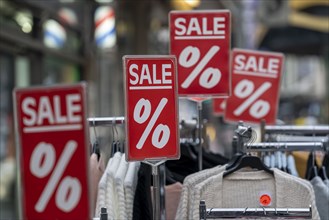 Sale, special offers of a clothing shop in the pedestrian zone, in Duisburg, North