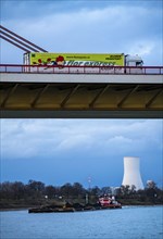 Beeckerwerther Brücke, motorway bridge, A42, truck, cargo ship on the Rhine, behind the STEAG