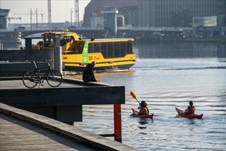 Water bus, kayaks in the harbour of Copenhagen, Denmark, Europe