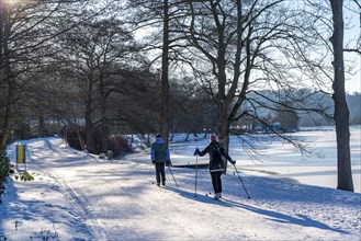 Winter in the Ruhr area, Lake Baldeney, snowy, partly frozen lake, Essen, cross-country skier,