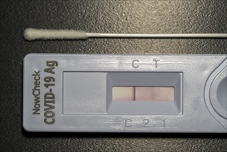 Covid-19 rapid test, antigen test, the abrasion of the swab is dissolved in a liquid and applied to