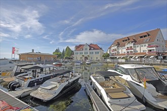 Marina with boats, yachts at the quay and tourist office, leisure harbour, tourist information,