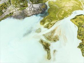 Glacial lake Lac de Chateaupre, lake just below the Moiry glacier, river arms in blue water, aerial