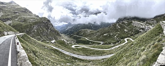 Panorama photo with HDR effect of winding pass road to Alpine pass Colle del Col de Nivolet, low