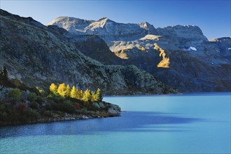 Autumn colours at Lac d'Emosson in the Valais mountains with Pic de Tenneverge in the background,