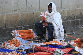 Europia district, Debre Lebanon, Lipanus monastery, man sorting wax torches for the pilgrims at the