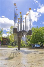 Modern fountain sculpture with bubbling water and blue sky in the background, Böblingen, Germany,