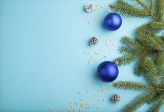 Christmas or New Year composition. Decorations, blue balls, cones, fir and spruce branches, on a