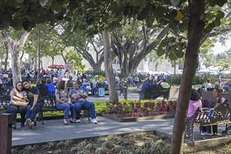 Mexicans in the Jardin Juárez, Juarez Garden, Zócalo, oldest public square in the city centre of