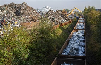 Scrap metal recycling loading train wagons with processed metals, EMR company, Swindon, England, UK