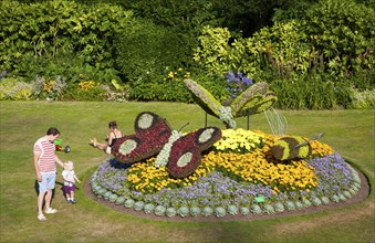 Floral display of butterflies in Parade Gardens public park in city centre of Bath, Somerset,