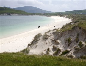 Sandy beach and aquamarine sea at Vatersay Bay, Barra, Outer Hebrides, Scotland, UK