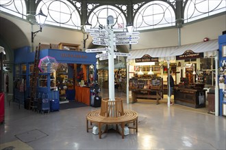 Mile marker of distances to destinations inside Guildhall market, Bath, Somerset, England, UK