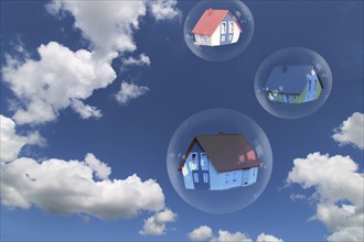 Symbolic image of a property bubble: soap bubbles with detached houses against a blue sky