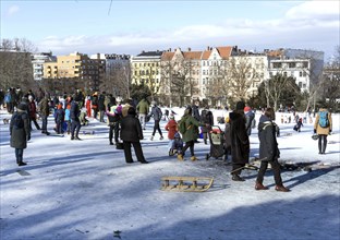 Tobogganing fun in Berlin's snow-covered Viktoriapark. Snow and icy cold continue to dominate the