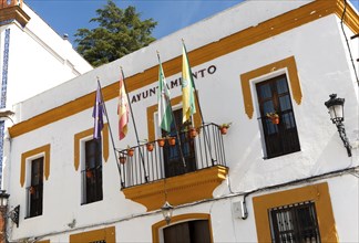 Ayuntamiento town hall building with flags in village of Alajar, Sierra de Aracena, Huelva