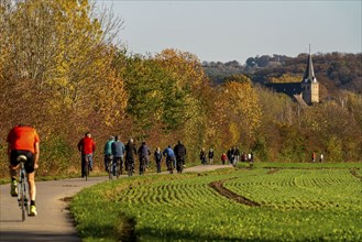 Cycle path through the Ruhraue near Essen-Kettwig, in the south of Essen, Marktkirche, part of the