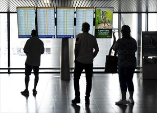 Info screens for departures, arrivals at Amsterdam Schiphol Airport, Terminal, Netherlands