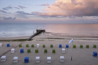 Pier and beach chairs on the North Sea coast, evening light, Wyk, Föhr, North Sea island, North