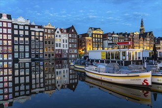 Canal houses on the Damrak, in the centre of the old town of Amsterdam, harbour, starting point of