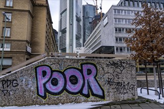 Winter in Frankfurt, view of the city skyline, graffiti on a wall at the theatre tunnel, Poor,