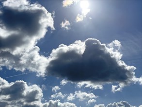 Dark clouds in front Stratocumulus in backlight in the background Altocumulus Cluster clouds in