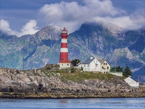 Lighthouse on island Skrova, rocky small island, view towards Lofoten islands, Norway, Europe