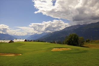 Crans Sur Sierre Golf Course with Hole 7 and Mountain View in Crans Montana in Valais, Switzerland,