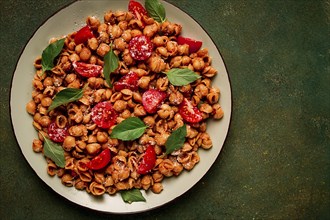 Tuscan pasta with smoked paprika and basil, parmesan cheese, Italian traditional cuisine