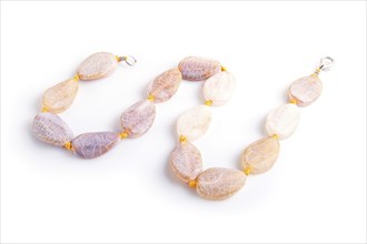 Dragon vein agate colored beads isolated on white background. top view, close up