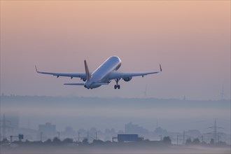 Passenger aircraft after take-off, Condor, fog, in front of sunrise, fog, Baden-Württemberg,