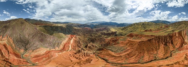 Panorama, Eroded mountain landscape, Canyon with red and orange rock formations, Aerial view,