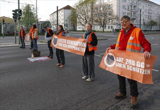 Activists of the Last Generation block a street, Berlin, 24 04 2023