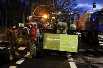 Thousands of farmers demonstrate with their tractors against the planned cancellation of the