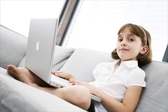 A little girl with a laptop is tired, Studio