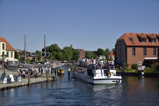 Europe, Germany, Mecklenburg-Western Pomerania, island town of Malchow, Lake Malchow, at the swing