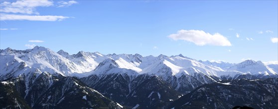 Alpine panorama with snow-covered mountain peaks in winter. Taken in the ski resort of Serfaus Fiss