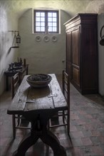 Kasteel van Laarne, interior showing room with antique furniture inside 14th century medieval