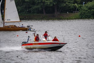 Lake Baldeney, sailing boat, DLRG rescue boat on an alarm trip, Essen, North Rhine-Westphalia,