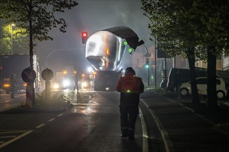 Transport of a 68 metre long, 22 tonne blade of a wind turbine, here in Breckerfeld, with a