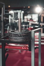 Close-up of a heavy weight on a weight bench in a modern fitness studio, Historic Fitness Studio,