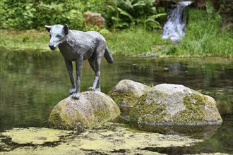 Heidelberg, Germany, June 8th 2024: Wolf sculpture at historic well called 'Wolfsbrunnen' in